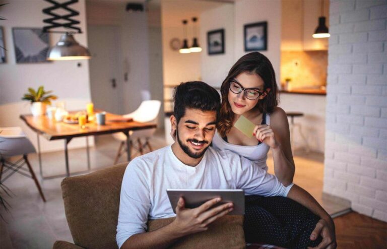 couple-reviwing-finances-on-laptop-900x579
